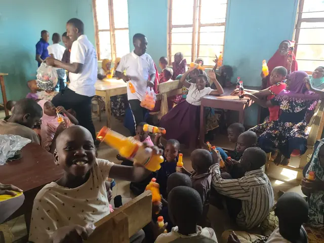 Children enjoying juice in the classroom