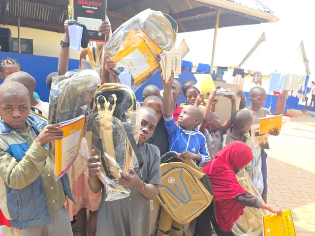 Children holding up their new school bags