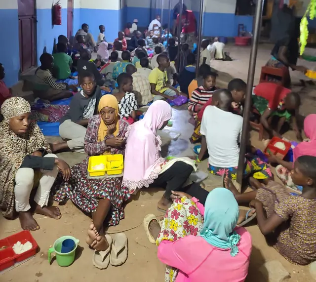 Children studying together on the floor